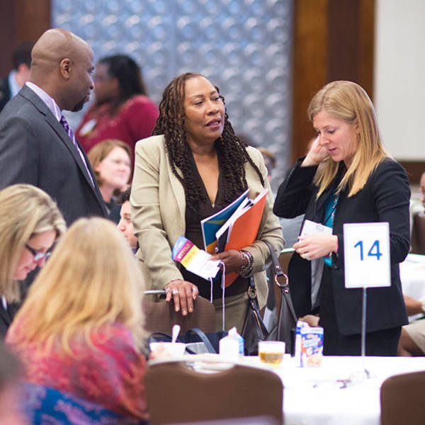 Members meet at a GEO conference